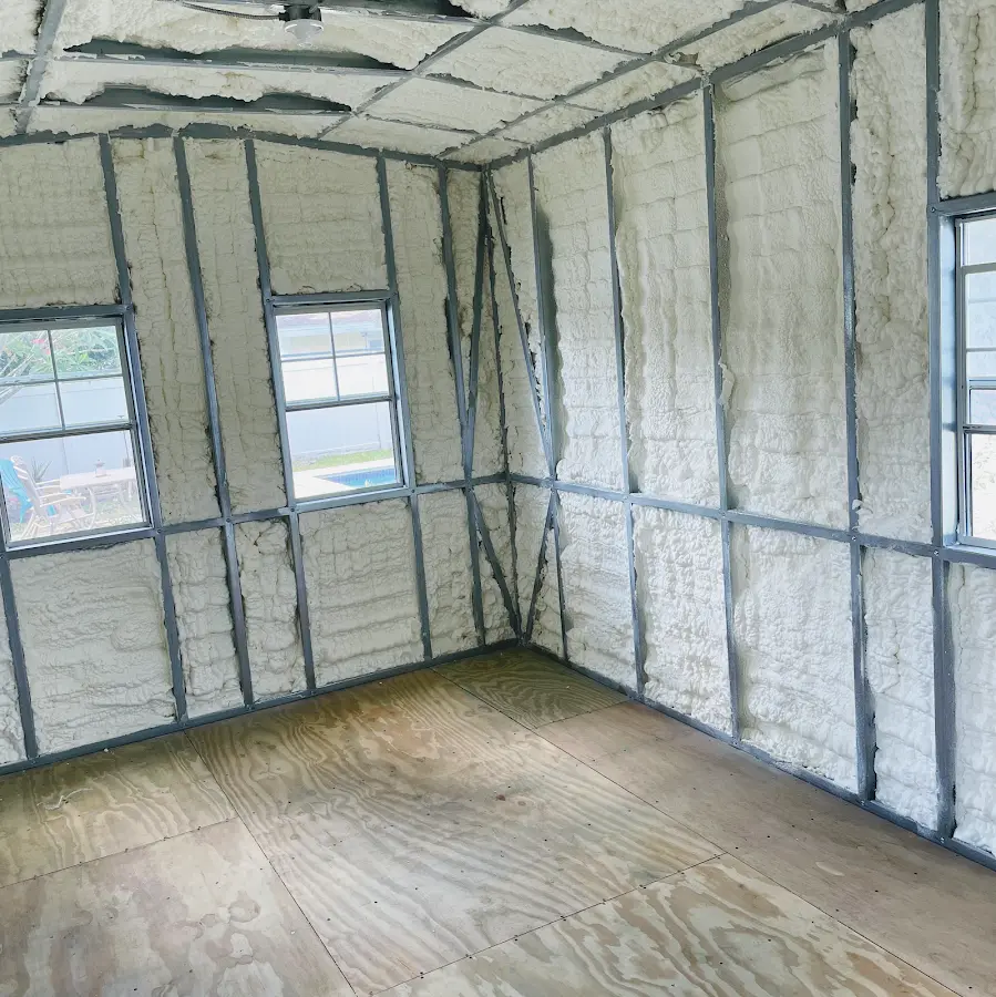Closed-cell spray foam insulation applied to wall cavities in a residential project in Marcy